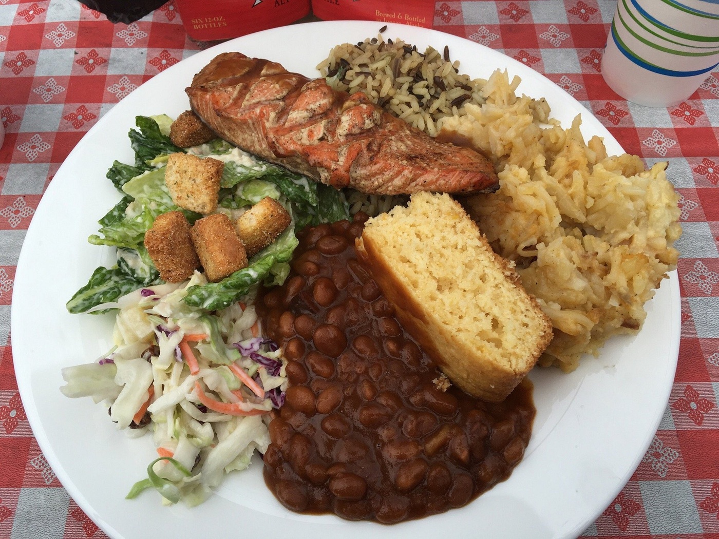 A visitor’s plate of salmon, rice, beans, salads and cornbread at Gold Creek Salmon Bake