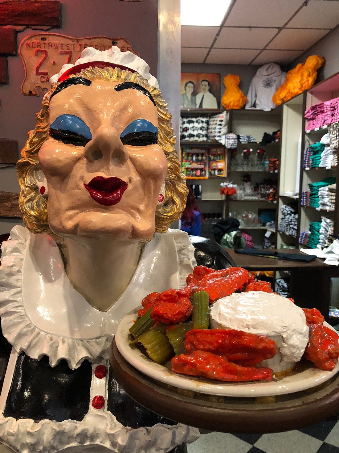 Chef statue holding a platter of wings inside Anchor Bar Buffalo