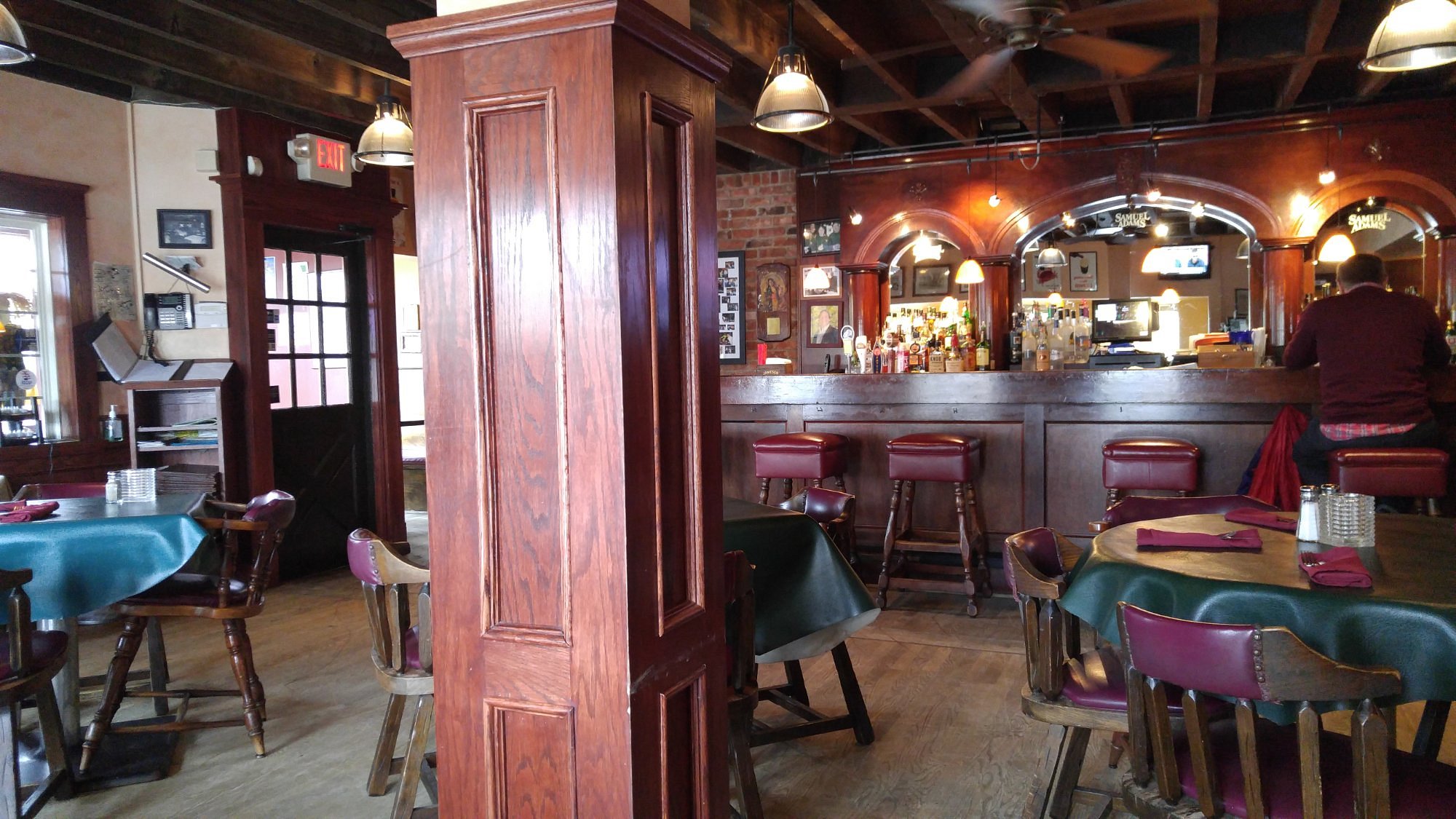 Wooden bar and dining area inside Glen Park Tavern