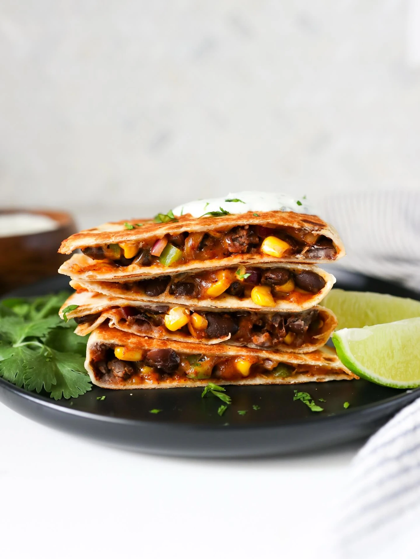 Stack of crisp black bean and cheese quesadilla wedges