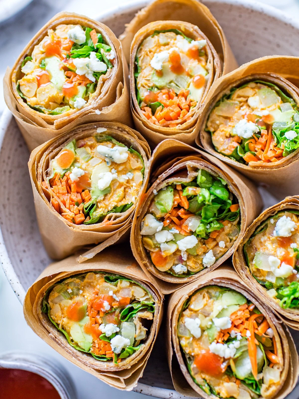 Chickpea and crunchy vegetable wraps sliced in half