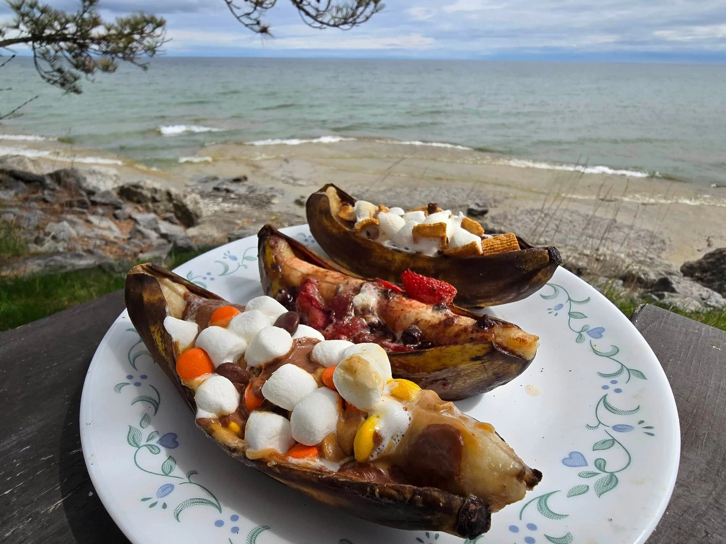 Warm banana boats filled with chocolate and marshmallows beside a lake