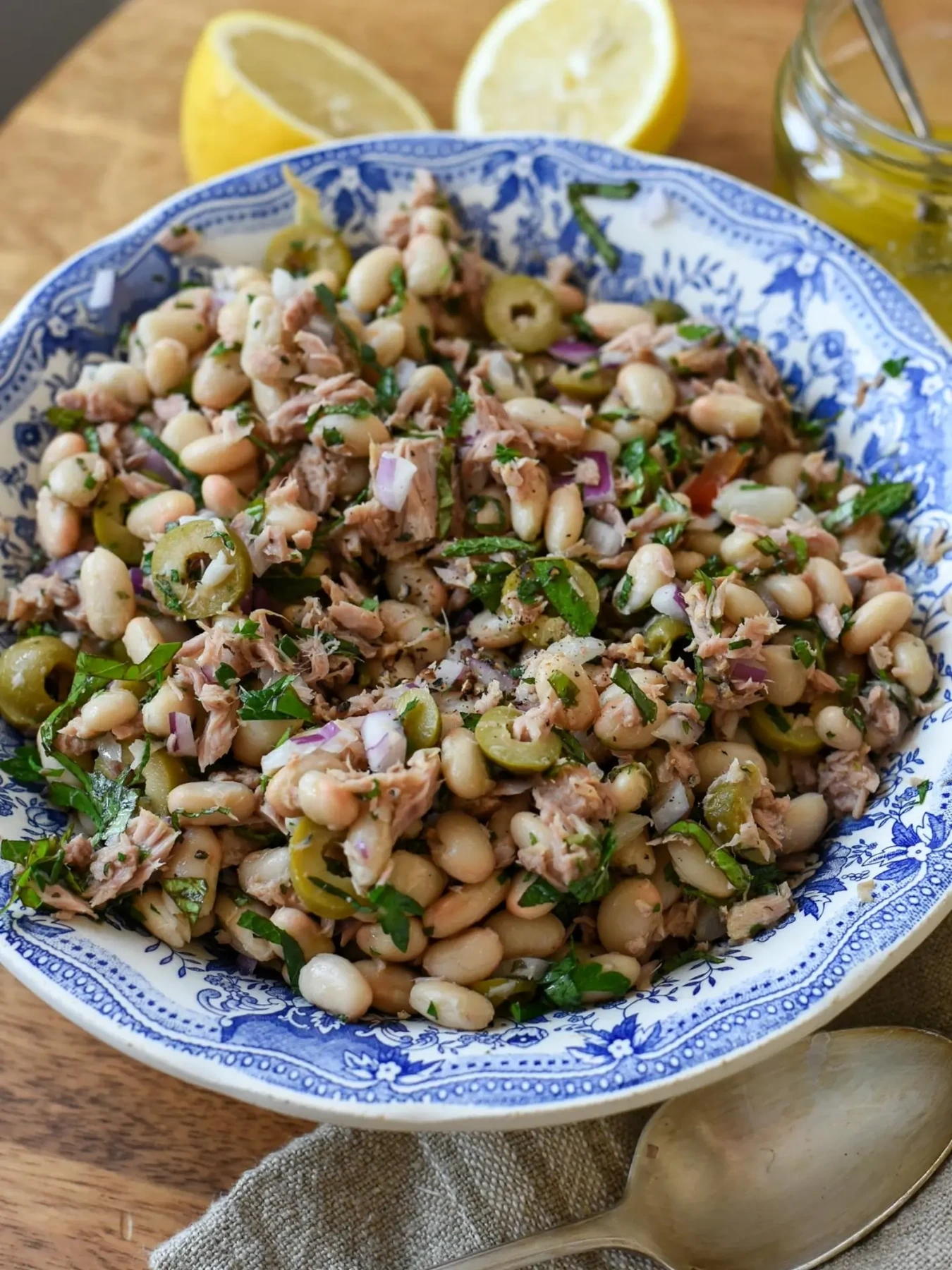 White bean and tuna salad with olives and chopped herbs