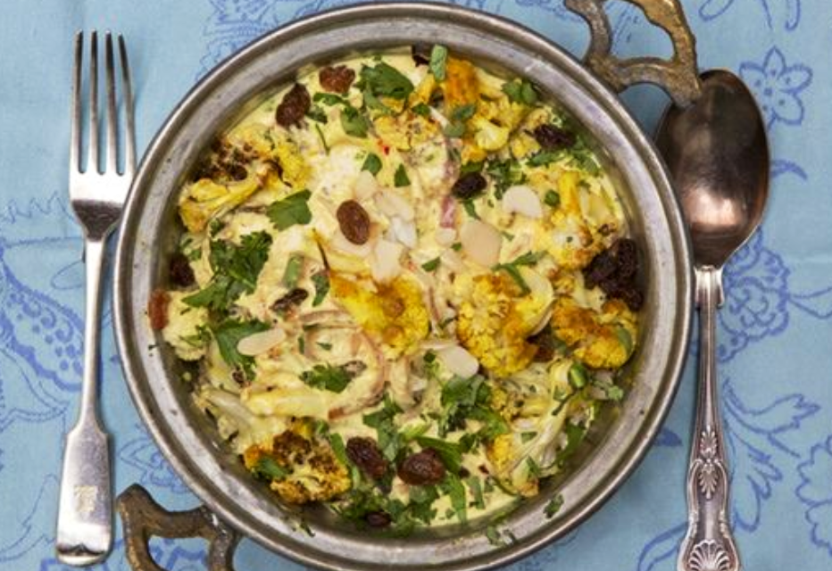 Cauliflower pasanda topped with coriander, sultanas and sliced almonds