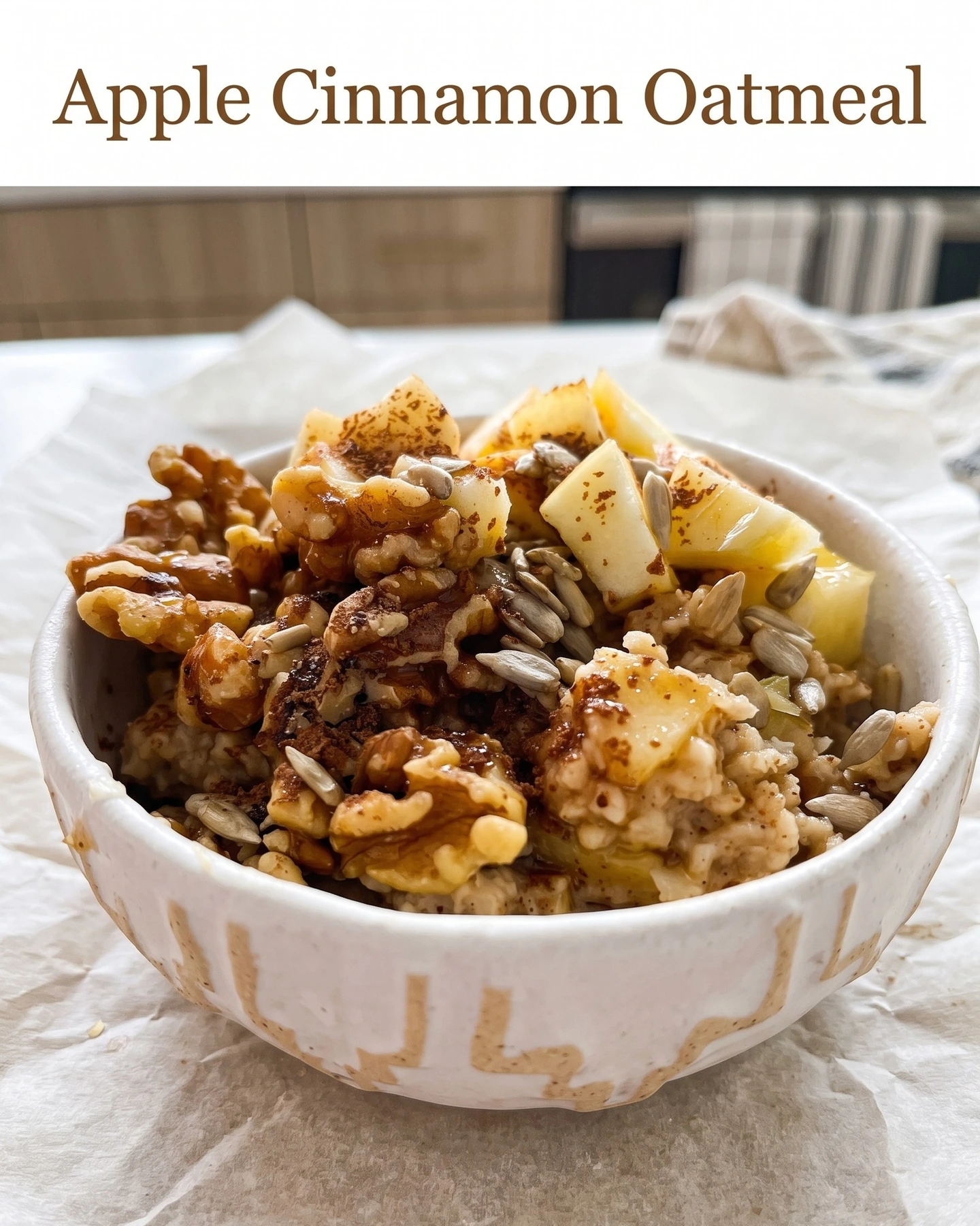 Apple cinnamon oatmeal topped with walnuts and seeds