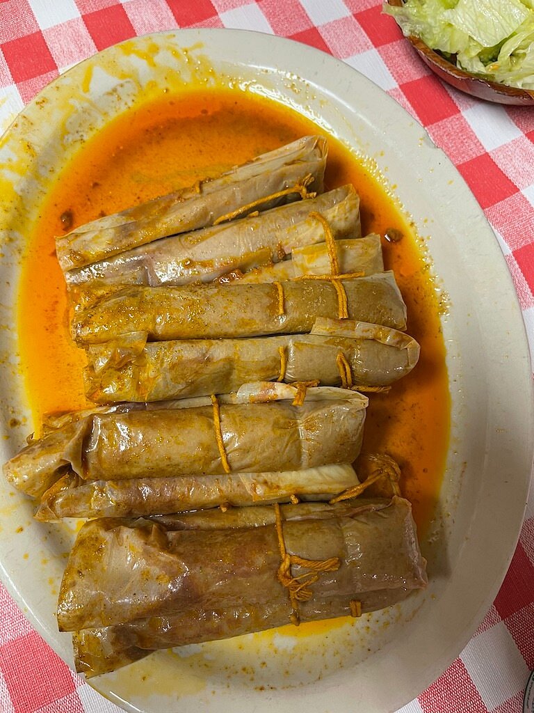 Wrapped hot tamales in seasoned broth at Doe’s Eat Place in Greenville