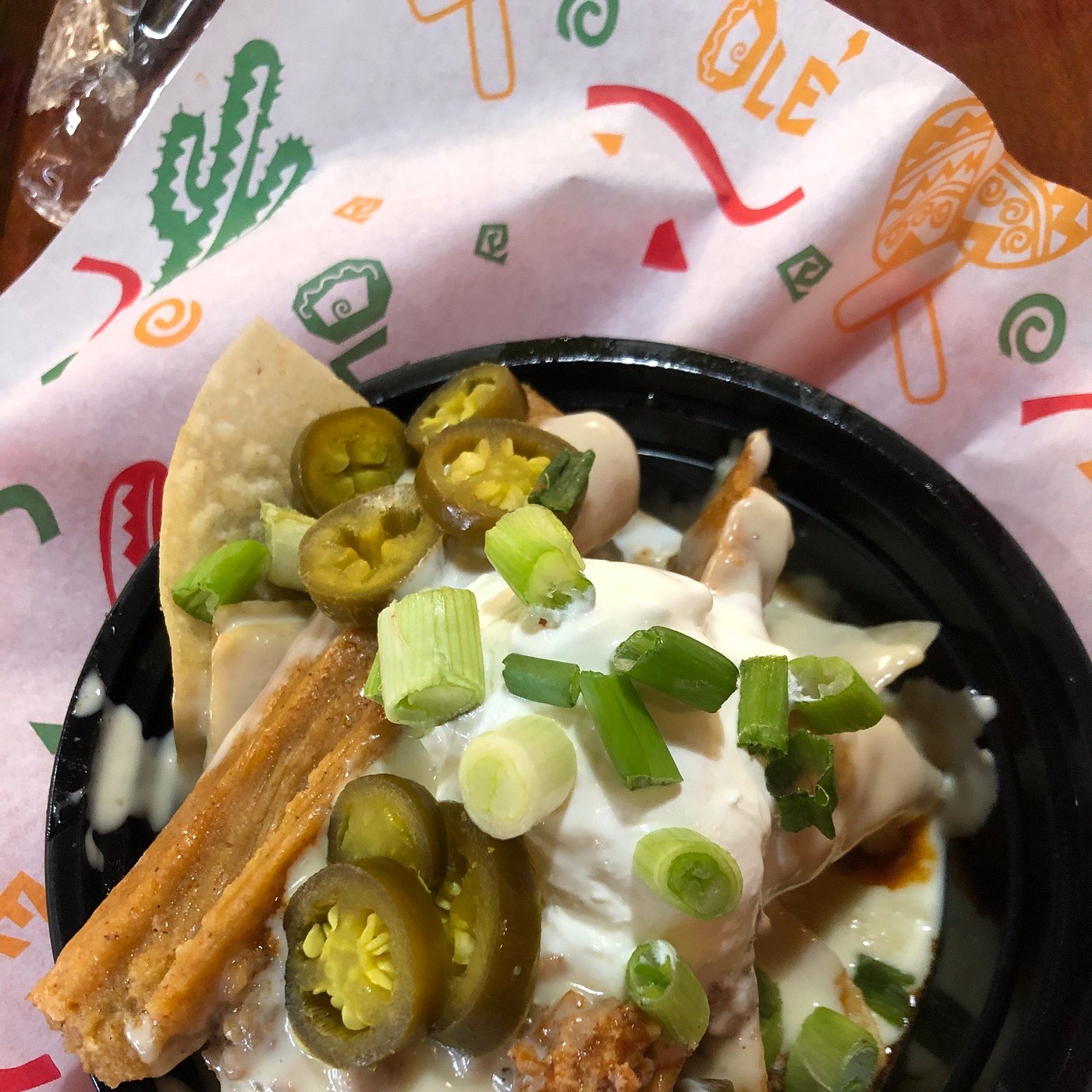 Loaded tamale pie topped with jalapeños and green onions at Hot Tamale Heaven