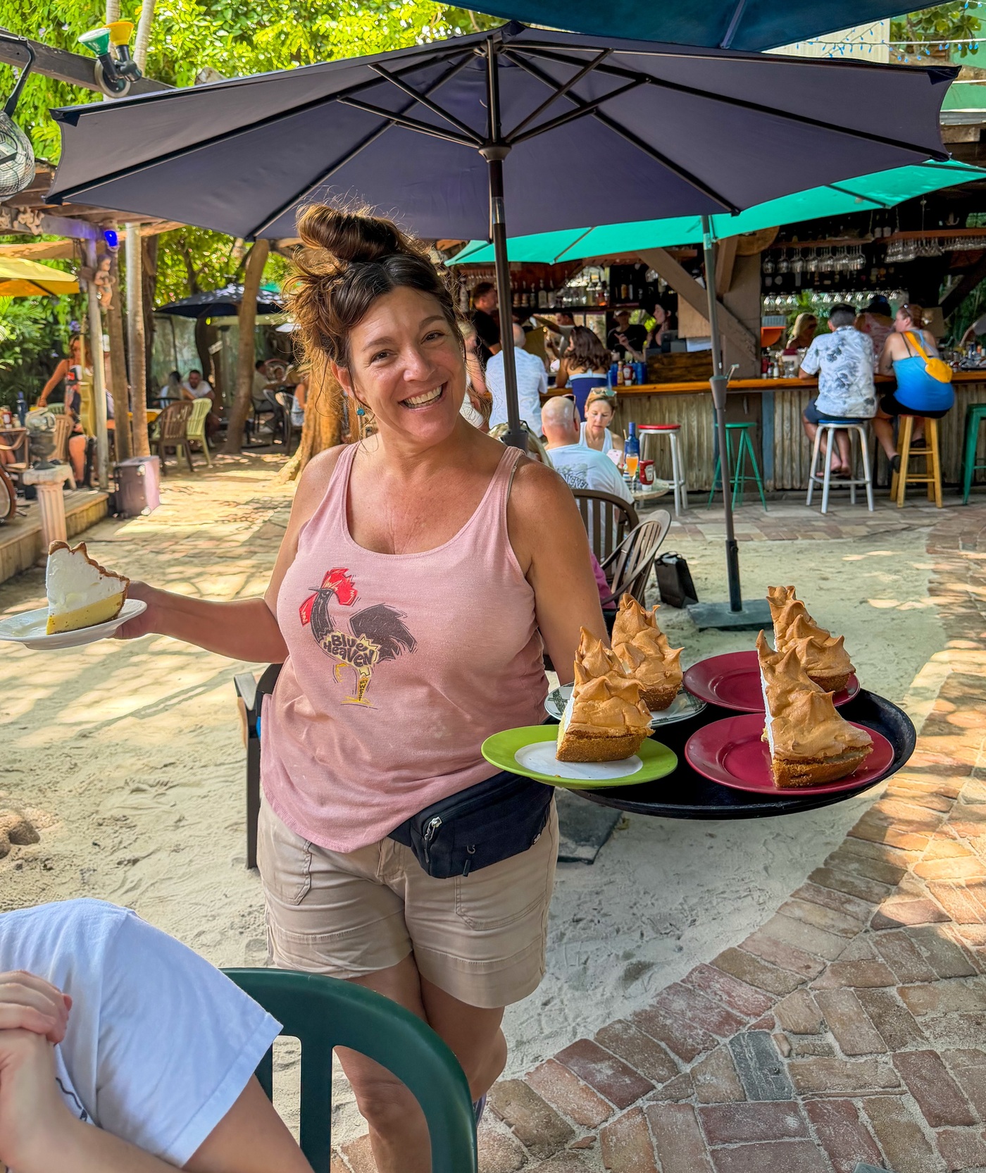 Meringue-topped Key lime pie slices being served in Blue Heaven’s courtyard