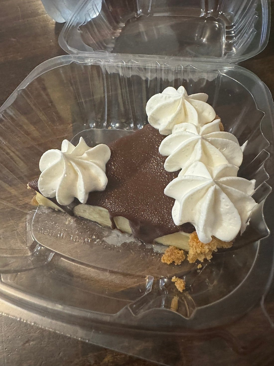 Chocolate-coated pie with whipped topping at Sweet Savannah’s