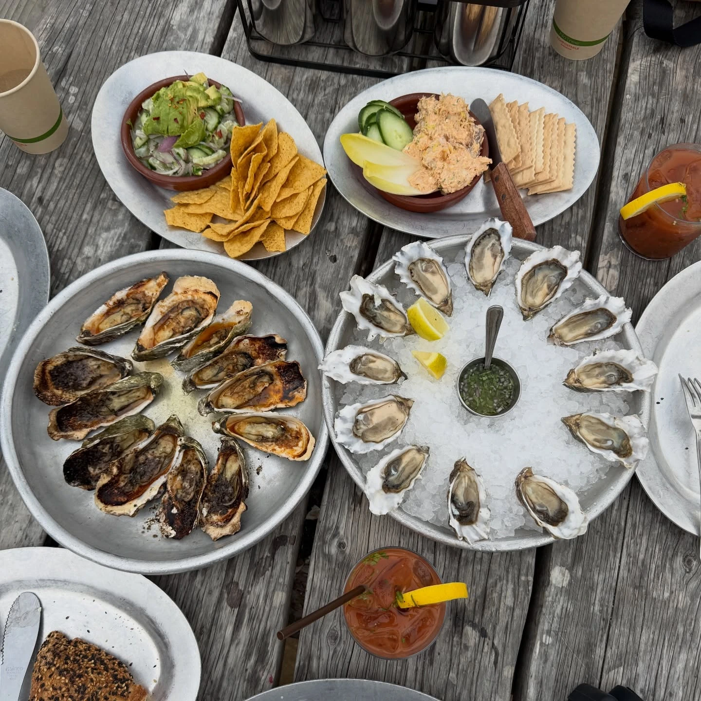 Raw and cooked oysters with sides at Hog Island Oyster Co. in Marshall, California
