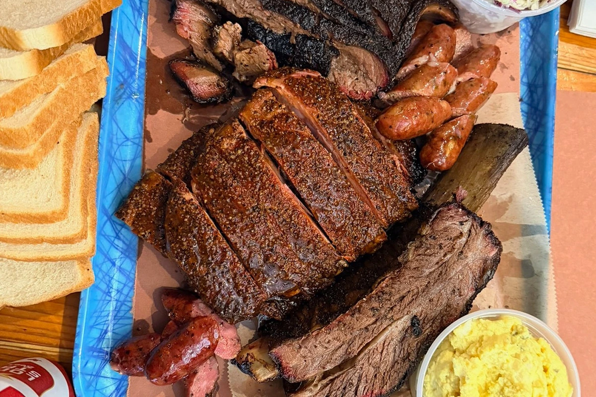Texas barbecue platter with sliced brisket, ribs and sausage at Franklin Barbecue