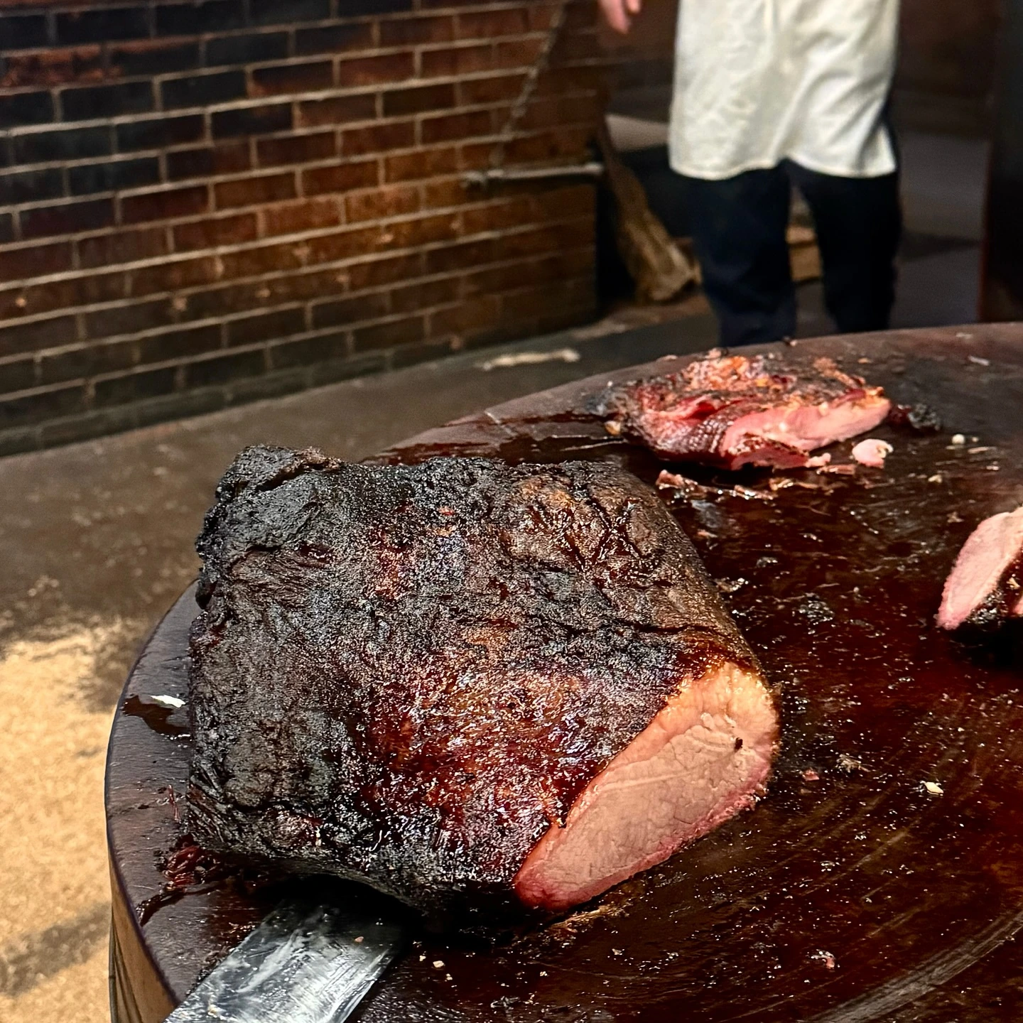 Smoked brisket on the cutting block at Kreuz Market in Lockhart, Texas