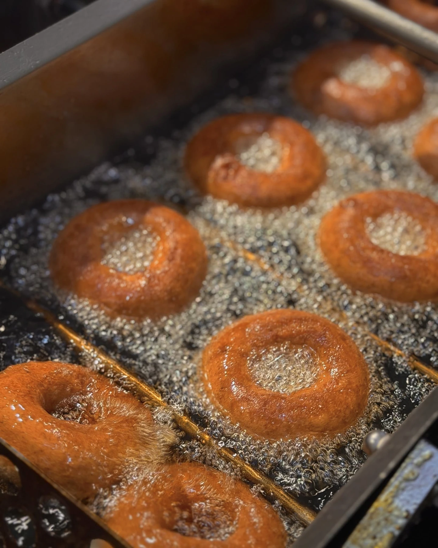 Cider donuts frying at Cold Hollow Cider Mill in Waterbury, Vermont