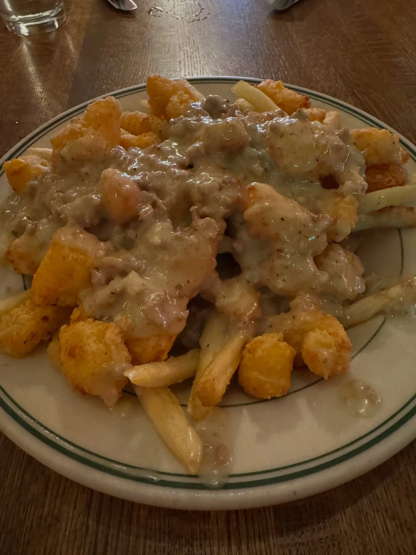 Poutine topped with fried cheese curds at The Old Fashioned in Madison, Wisconsin