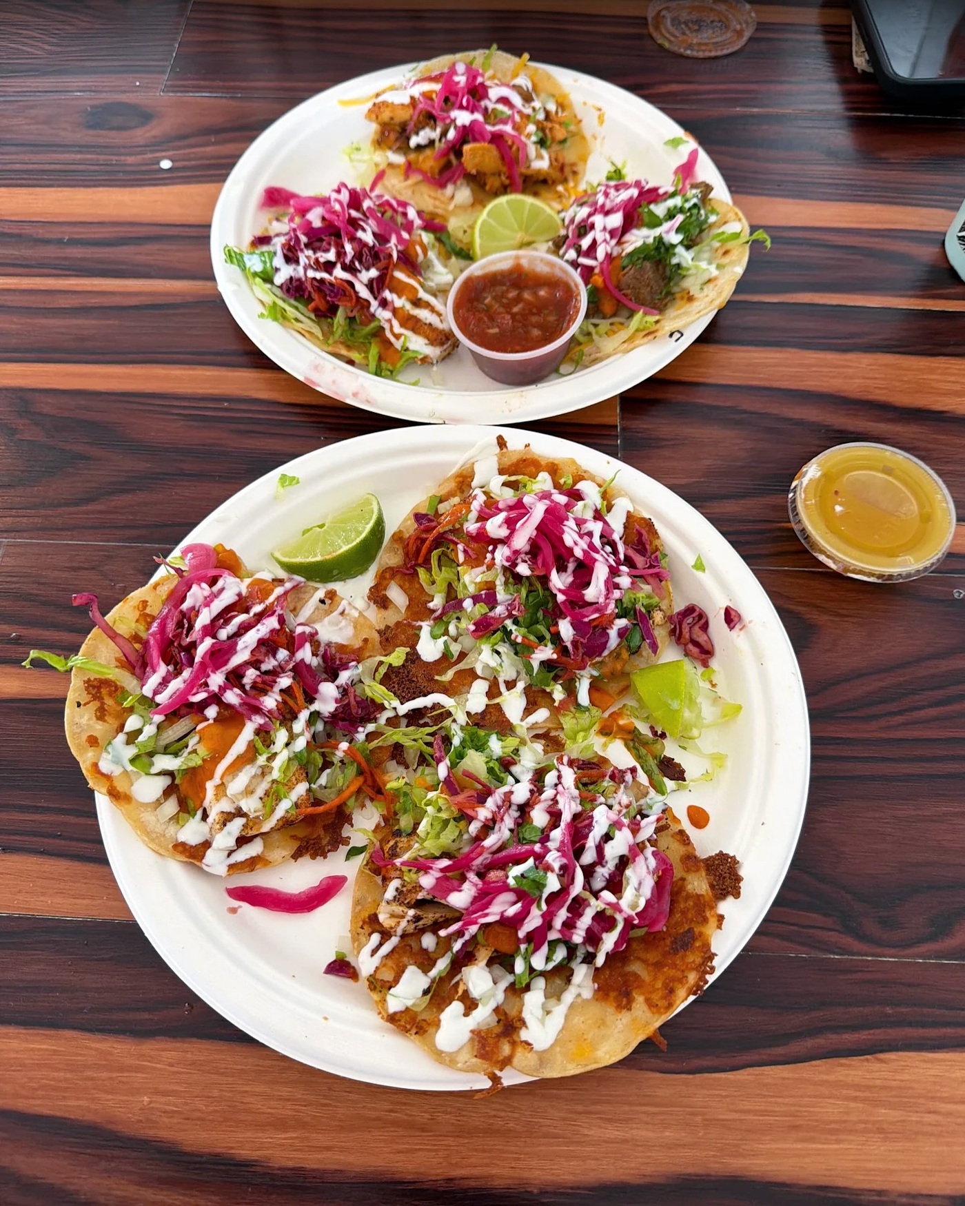 Shaka Tacoz plates with crisp cheese tortillas and colorful toppings