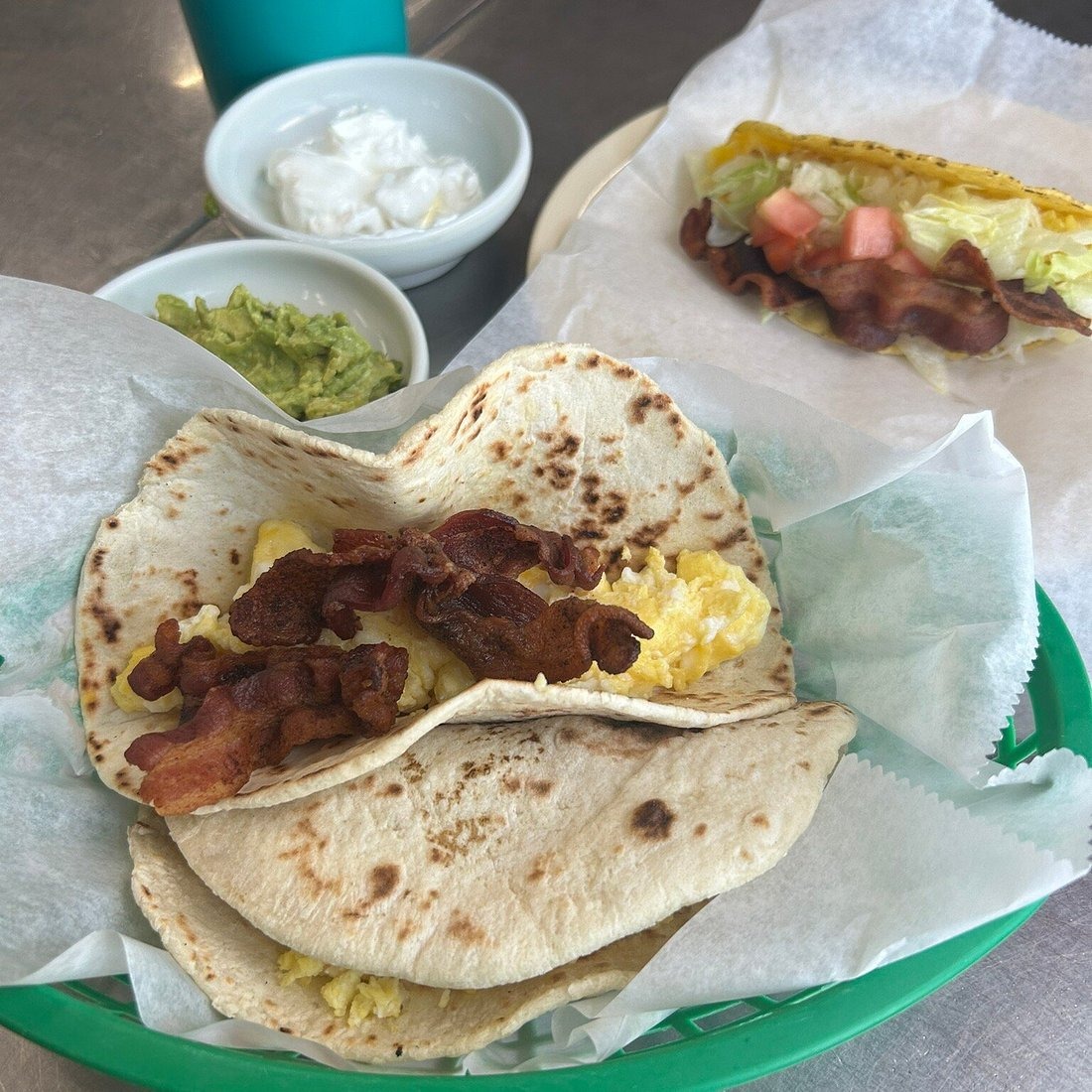 Bacon and egg tacos with guacamole at Little Taco Factory