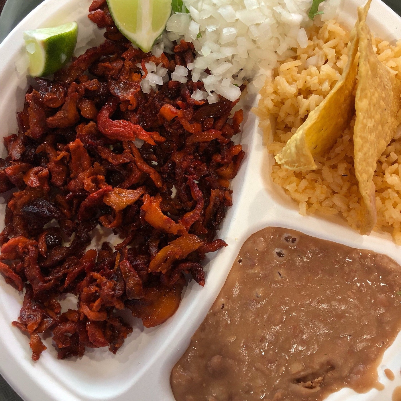 A plate of tacos, rice and beans at Mercado Central