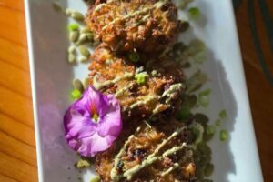 Wild rice, squash and apple fritters with pumpkin seed mousse at Wahpepah’s Kitchen