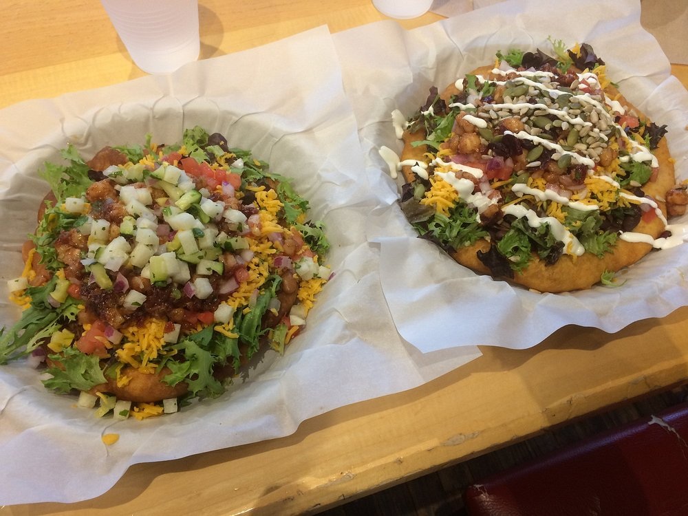 Frybread topped with beans, bison and vegetables at Tocabe