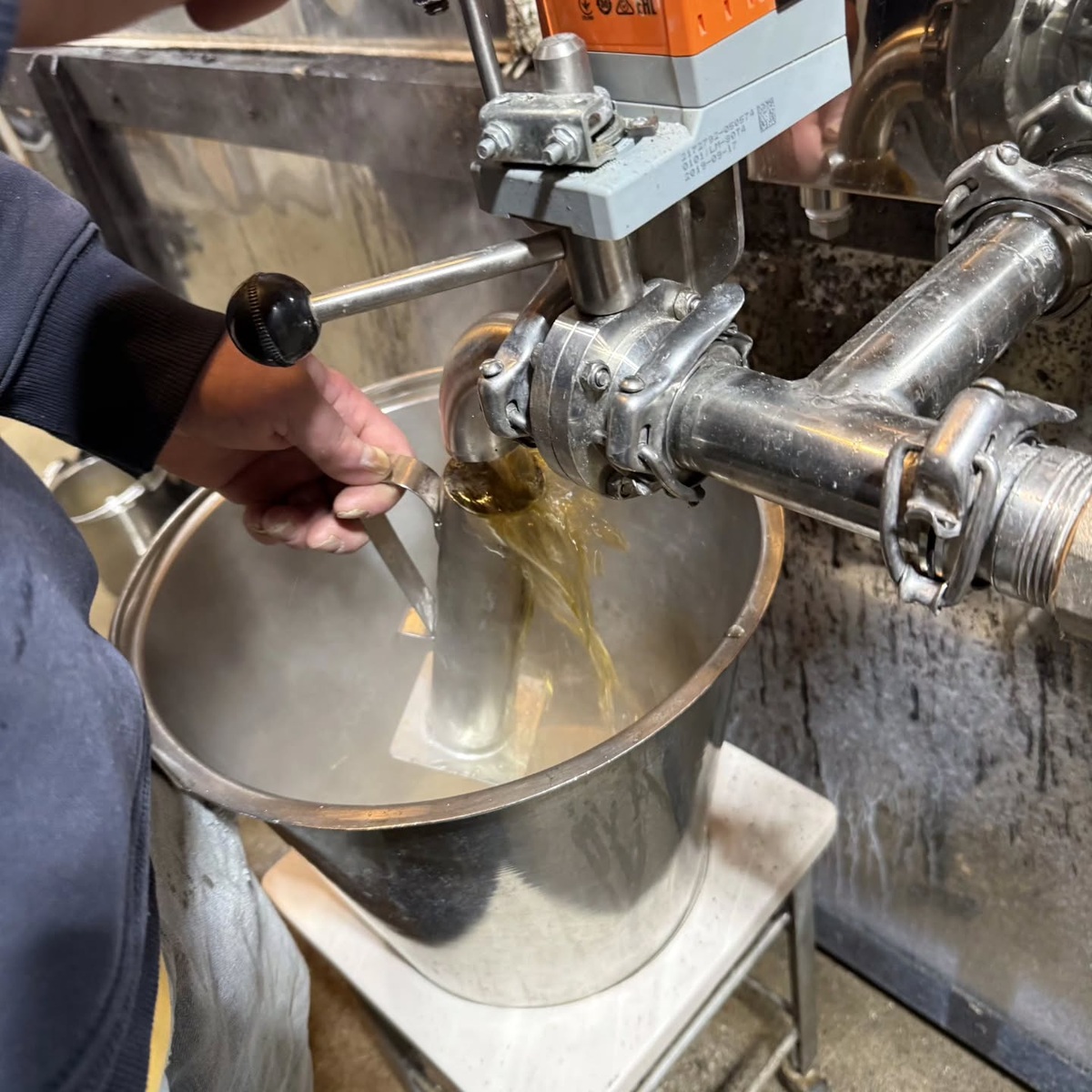 Drawing syrup during Merrifield Farm’s first boil of 2026