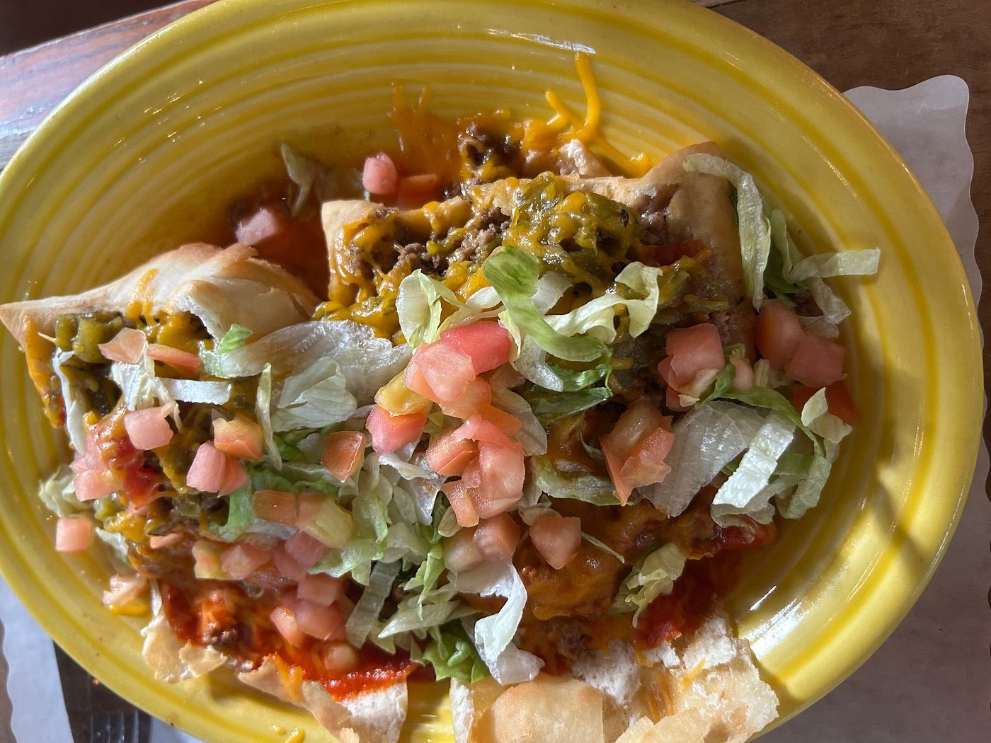 Stuffed sopaipillas with chile, cheese, lettuce and tomato at El Pinto