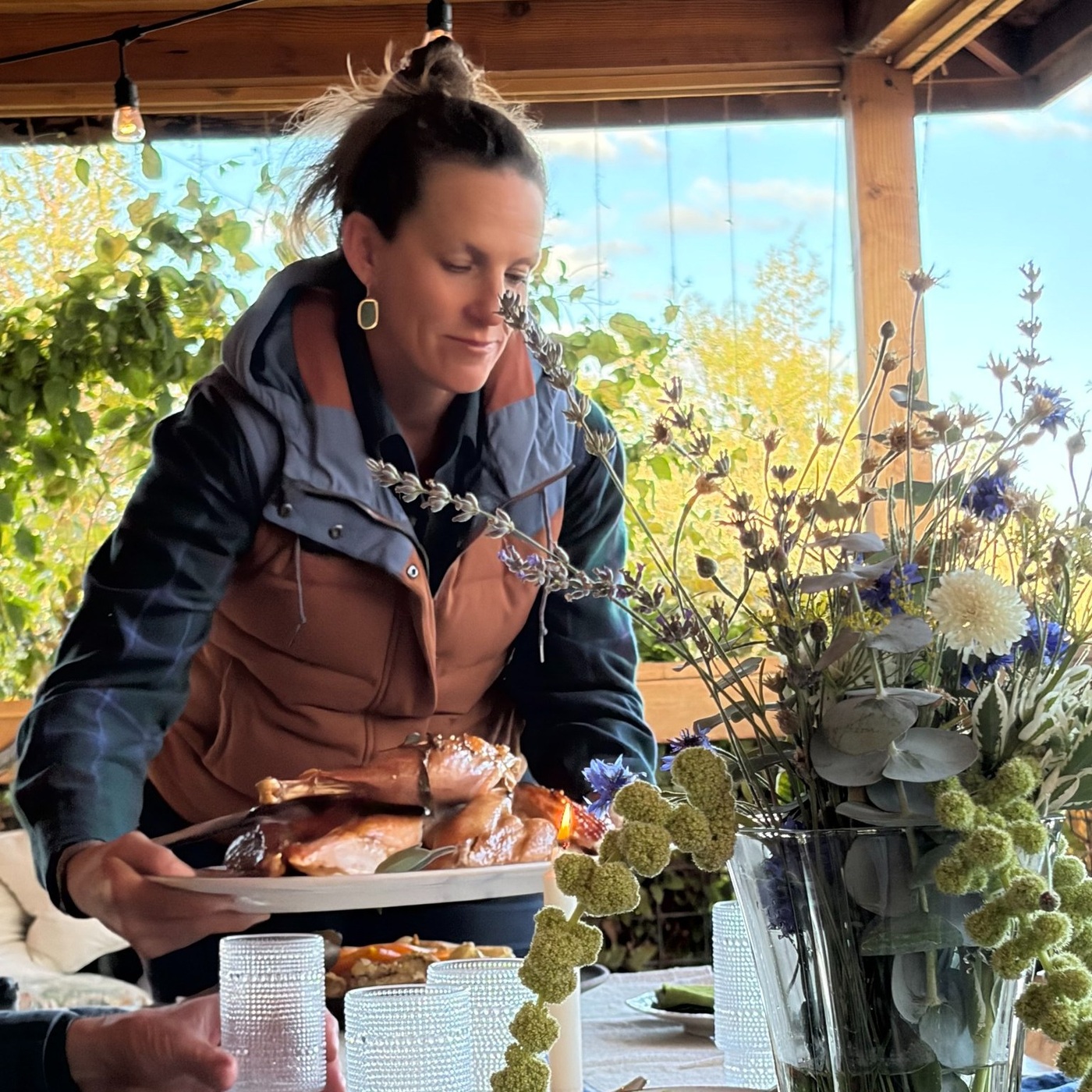 Serving a farm meal on the Rainshadow Organics deck