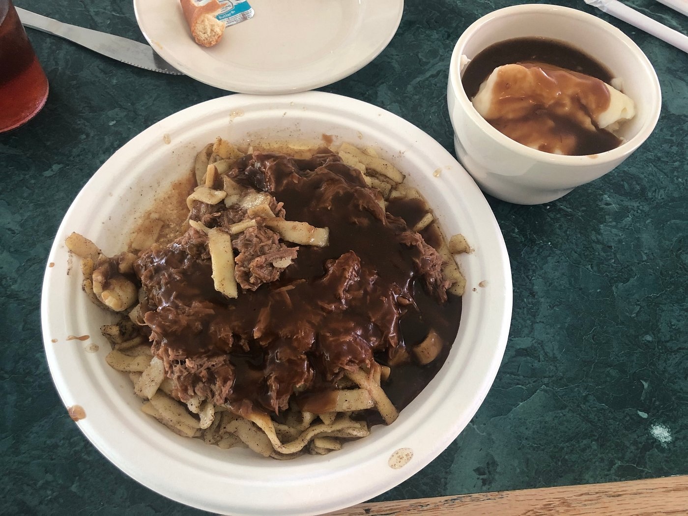 Buttered noodles topped with slow-roasted beef at Katie’s Kitchen