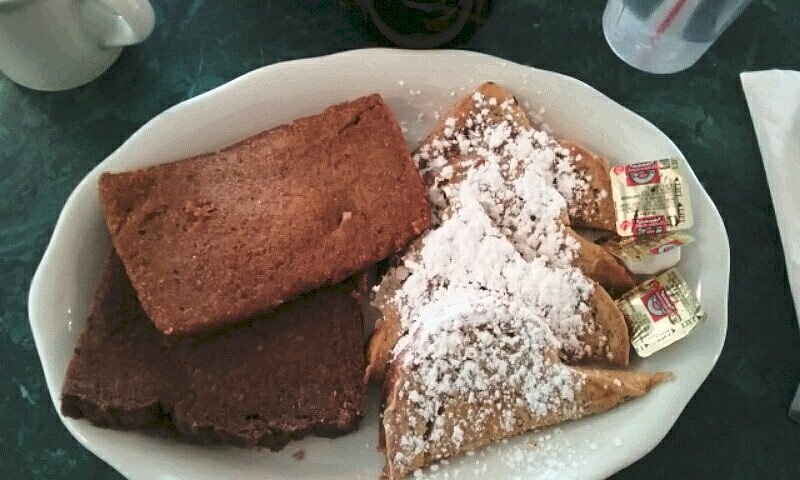 Scrapple beneath sliced cornmeal mush, with French toast at Katie’s Kitchen