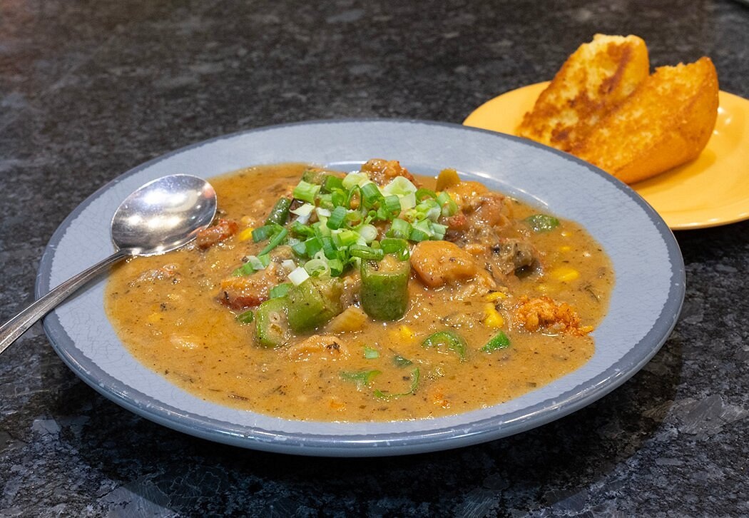 Étouffée over jambalaya with toasted cornbread at Beck’s Cajun Cafe
