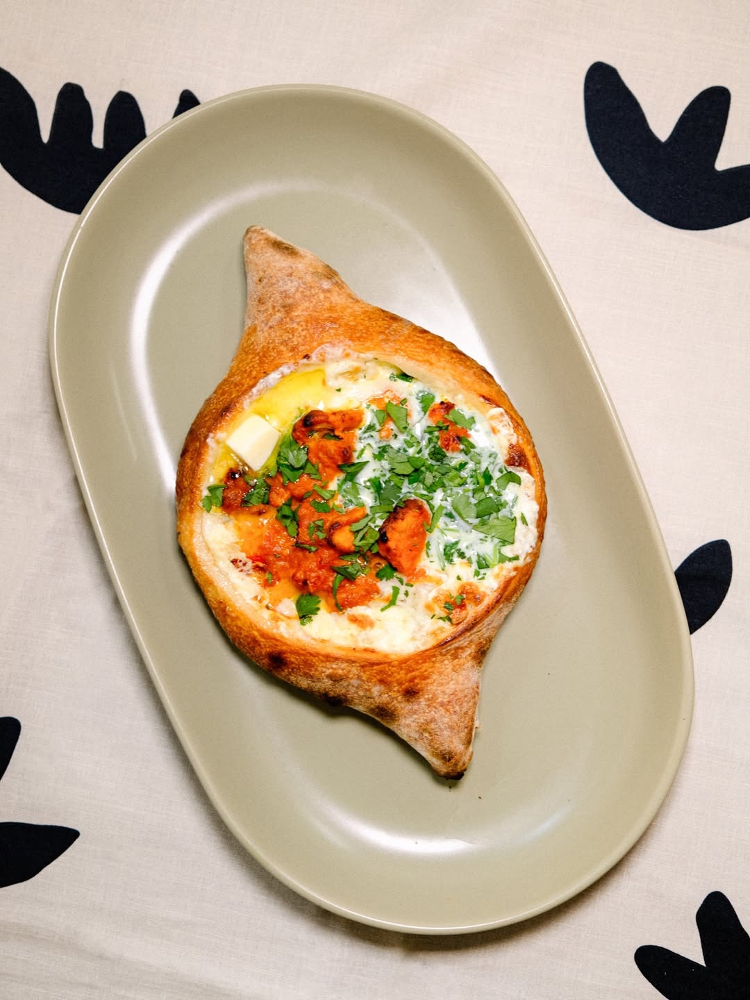 A seasonal butter-chicken adjaruli cheeseboat from Saami Somi