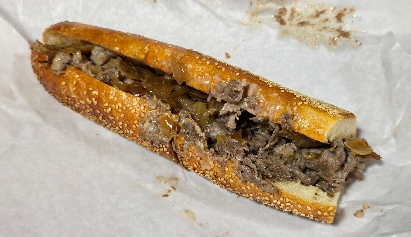 An Uncle Gus’ cheesesteak with Cooper Sharp cheese