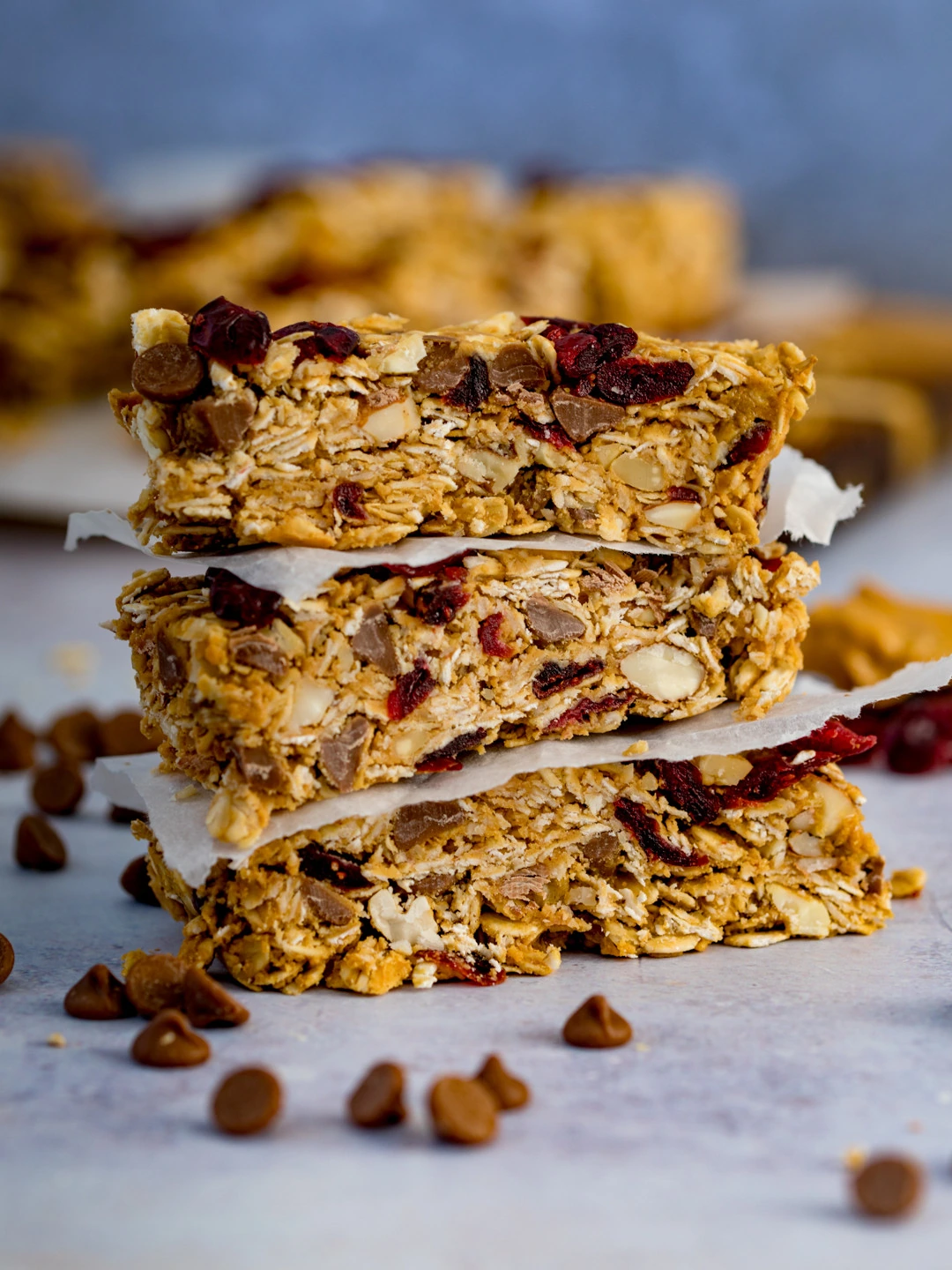 Stacked granola bars with oats, nuts, dried fruit and chocolate chips