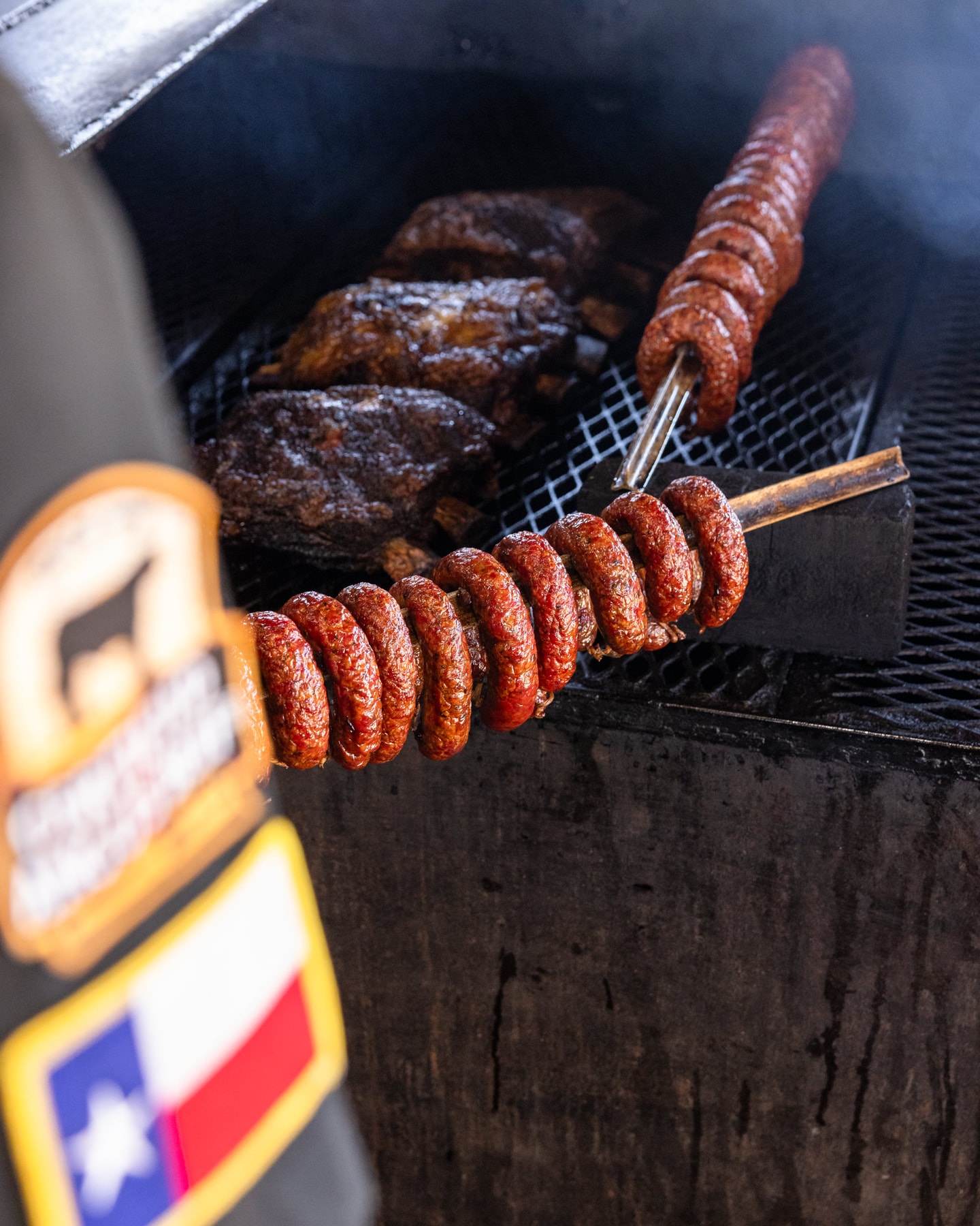 Sausage and smoked meat cooking at The Original Black’s in Lockhart