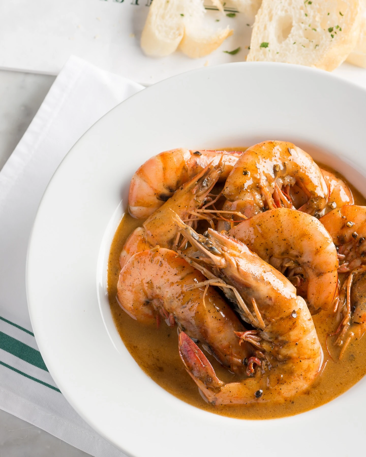 Head-on barbecue shrimp in peppery butter sauce at Mr. B’s Bistro