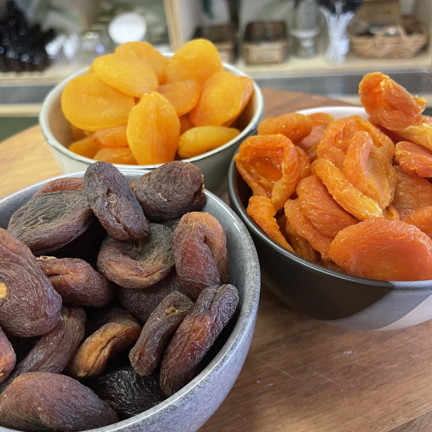 Three bowls of dried apricots