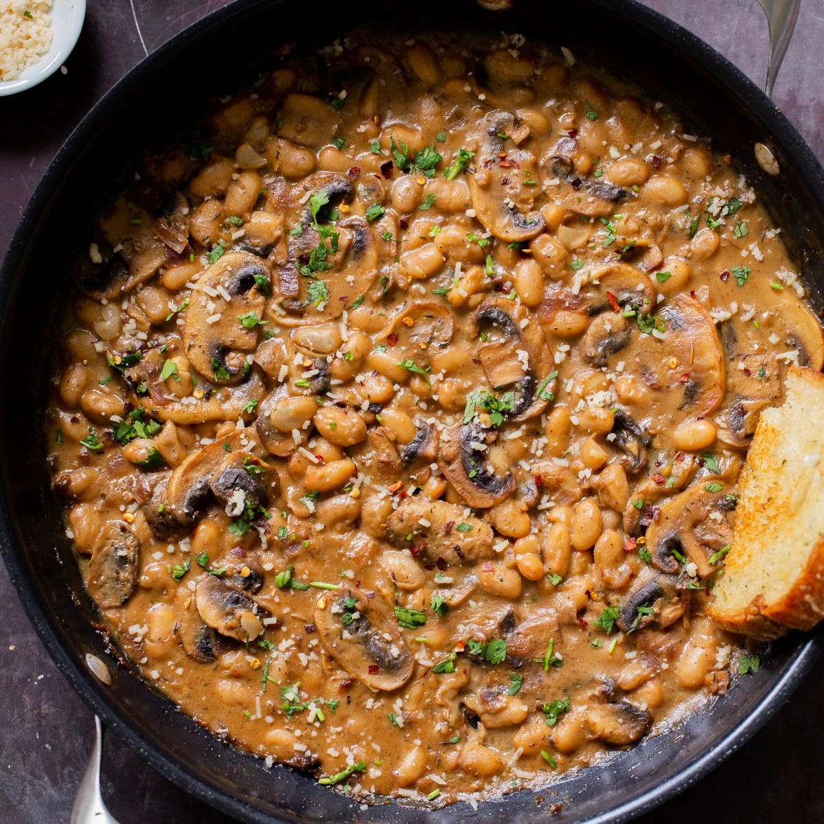 White beans and sliced mushrooms simmered in a creamy gravy