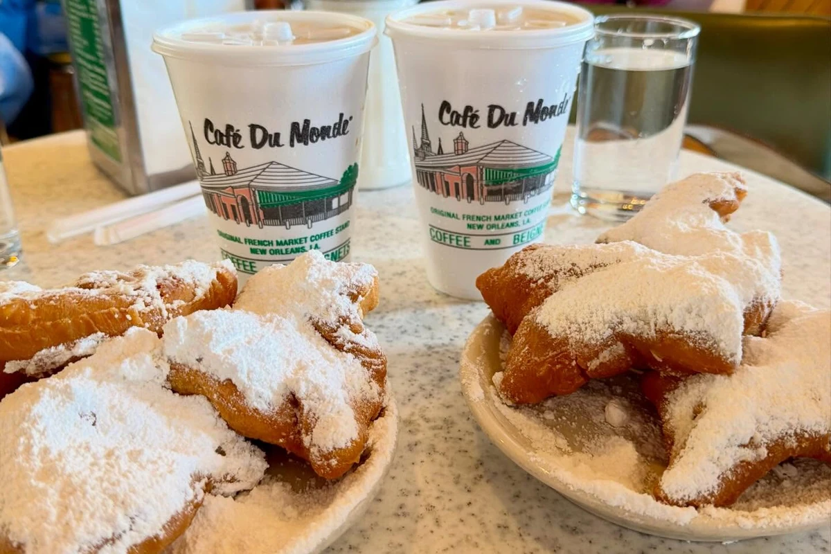 Powdered-sugar beignets and café au lait at Café du Monde in New Orleans