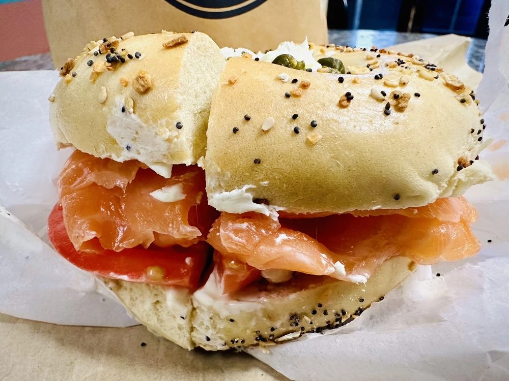 Smoked salmon, cream cheese and tomato on an everything bagel at H&H Bagels in New York