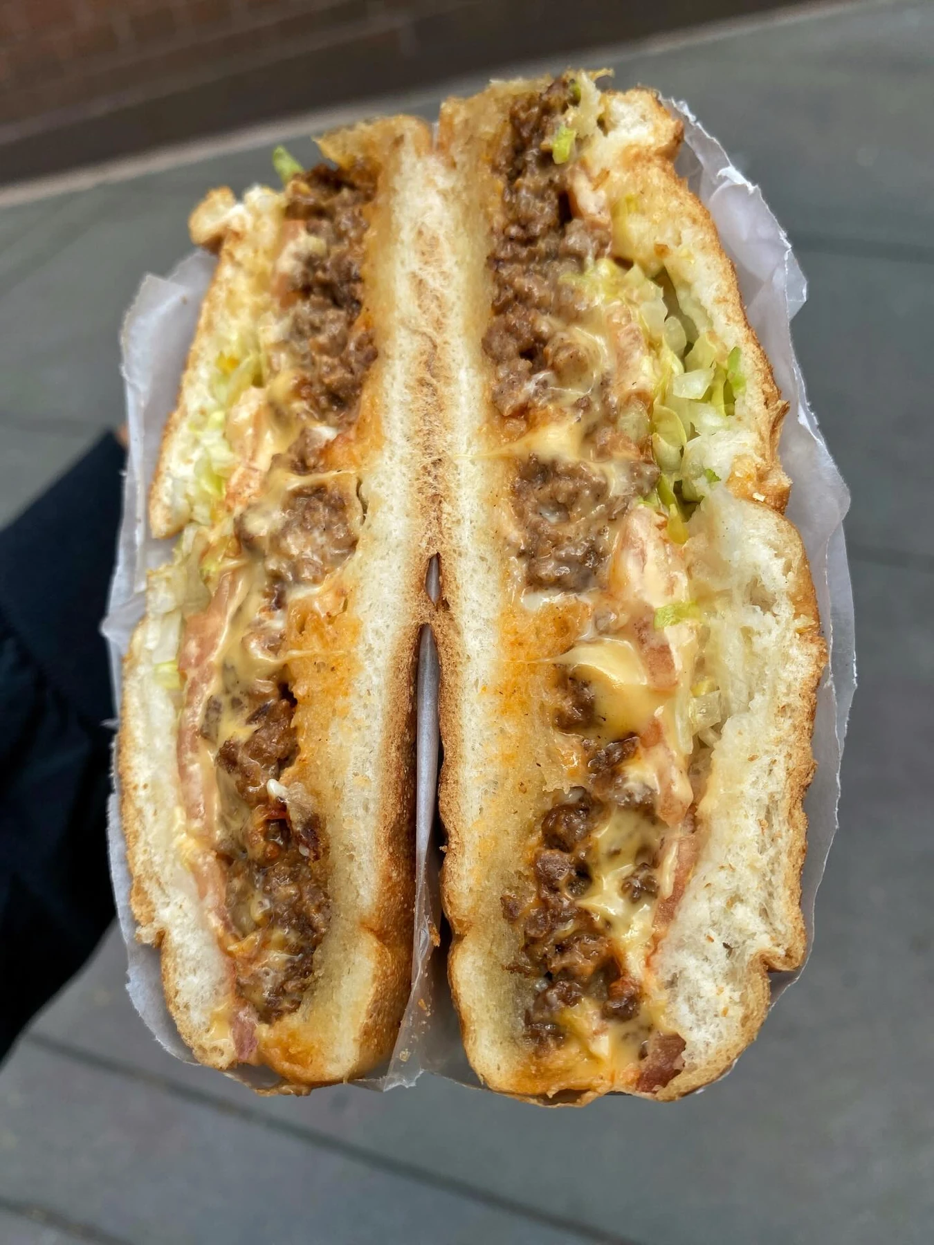Chopped cheese sandwich with chopped beef, melted cheese and lettuce at Hajji’s in New York