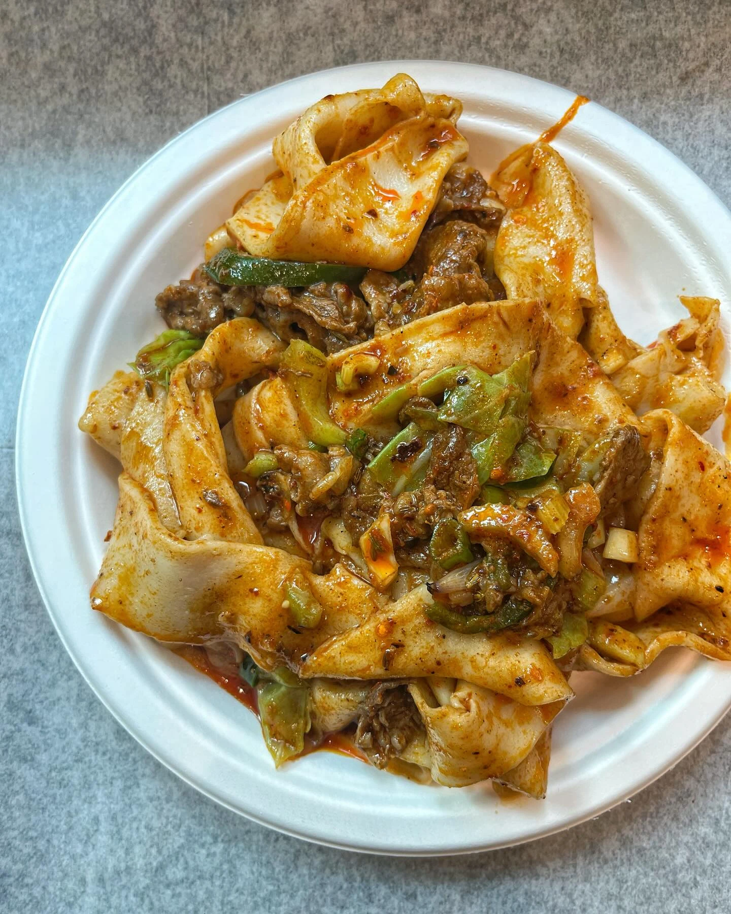 Wide hand-ripped noodles with spicy cumin lamb at Xi’an Famous Foods