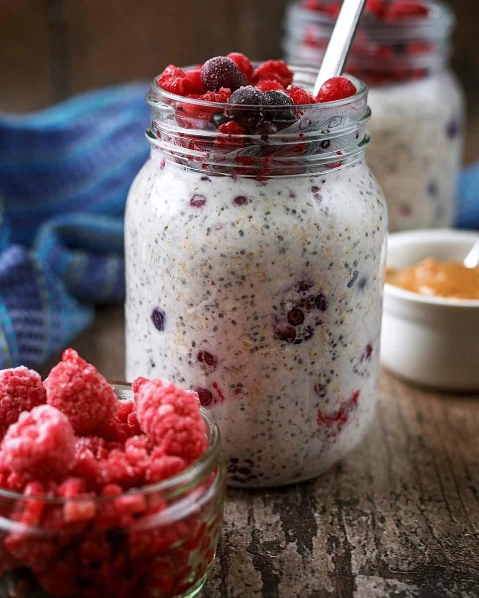 Overnight oats with berries in a glass jar