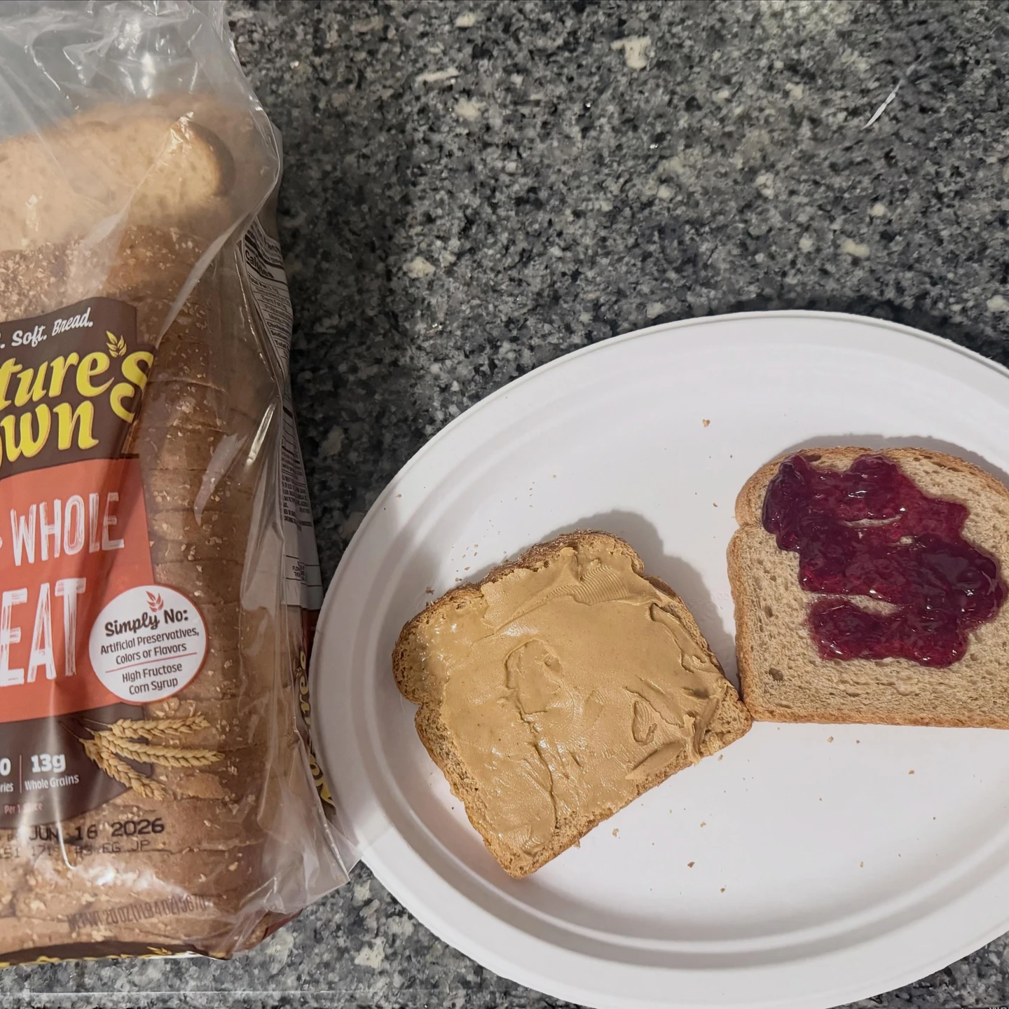 Peanut butter and jelly spread on whole-wheat bread