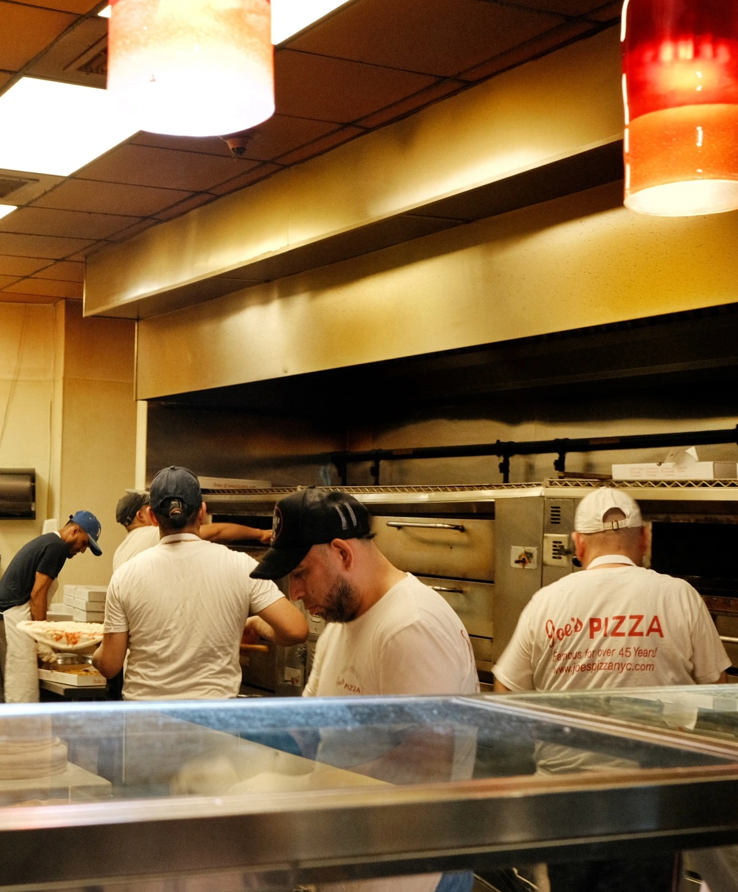 Restaurant staff preparing food in an open kitchen
