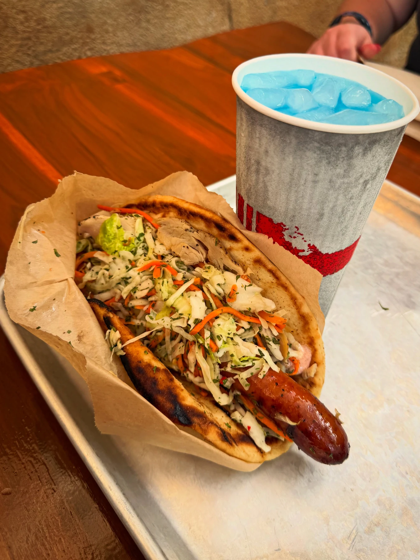 Ronto Wrap with roast pork, grilled sausage and slaw at Walt Disney World