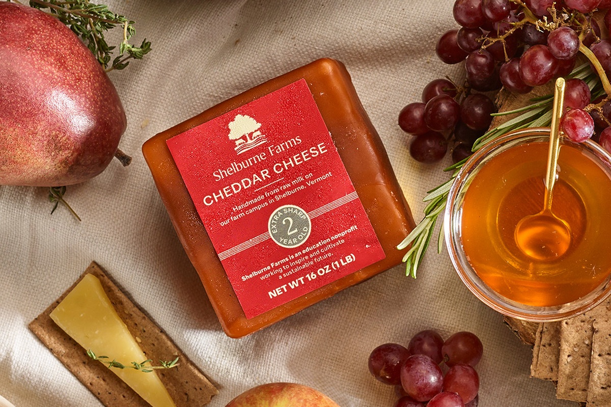Shelburne Farms cheddar cheese with grapes, fruit, crackers and honey